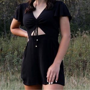 Express One-Piece Black & Gold Peek-a-Boo Ruffled Front Zippered Pocketed Romper